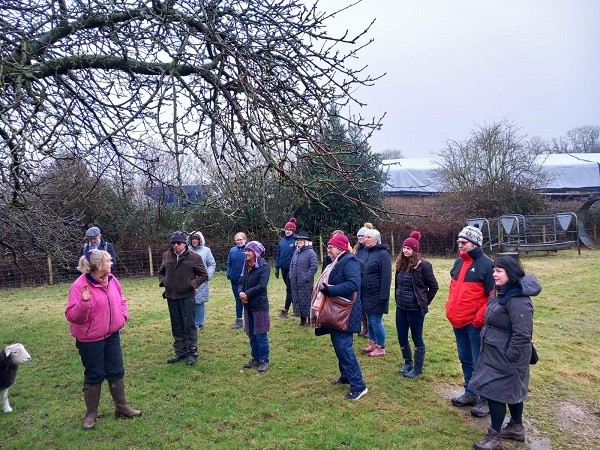 People standing in a field.